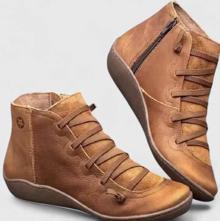 Women's ankle boots in tan with side zip closure and decorative lace-up detail across vamp