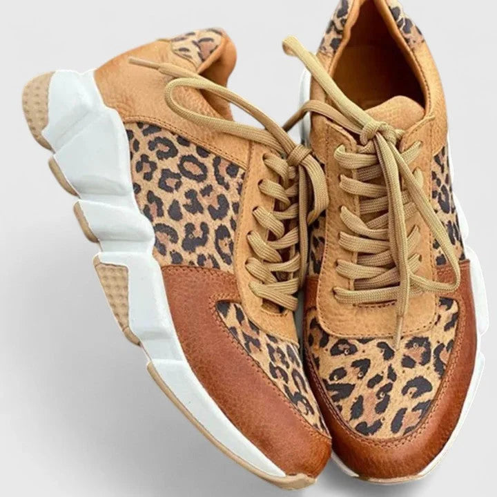 Close-up of leopard print trainers showing textured upper and lace-up design detail