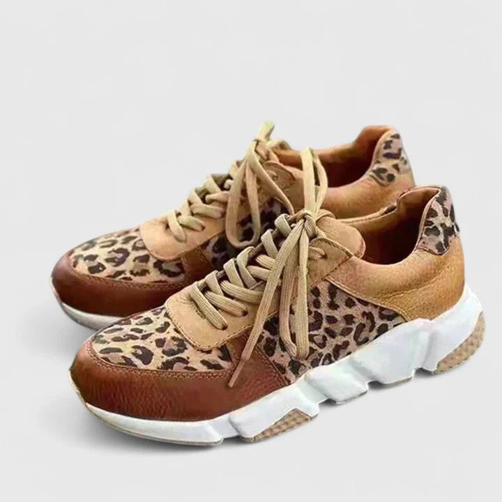 Full view of women's leopard print lace-up trainers with chunky sole and tan accents