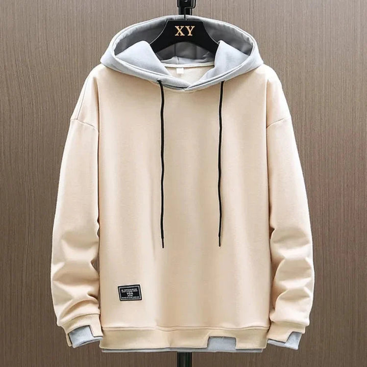 Męski dwukolorowy casualowy hoodie prezentujący detale dwukolorowego designu i regulowany kaptur ze sznurkiem