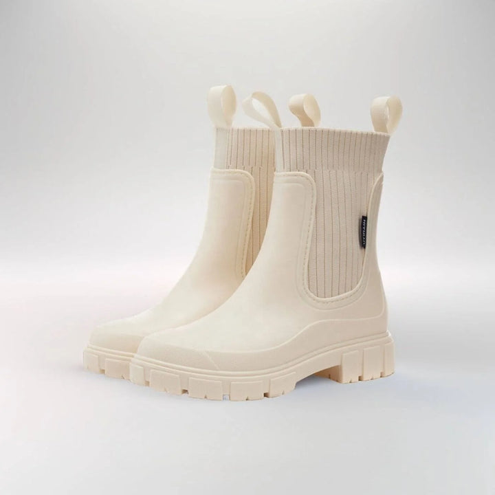 Women's Chelsea boots styled with trousers for rainy day commute or casual weekend wear