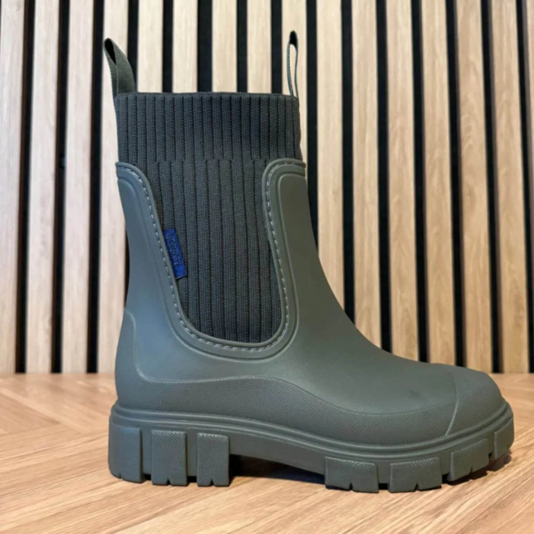 Close-up of waterproof upper material on women's Chelsea boots with smooth protective finish