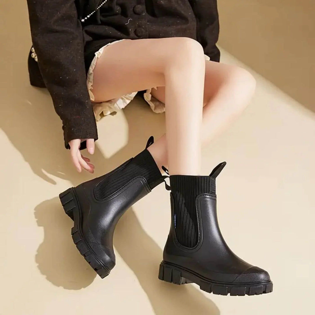 Close-up of ribbed knit elastic side panel on women's Chelsea boots with pull-on design