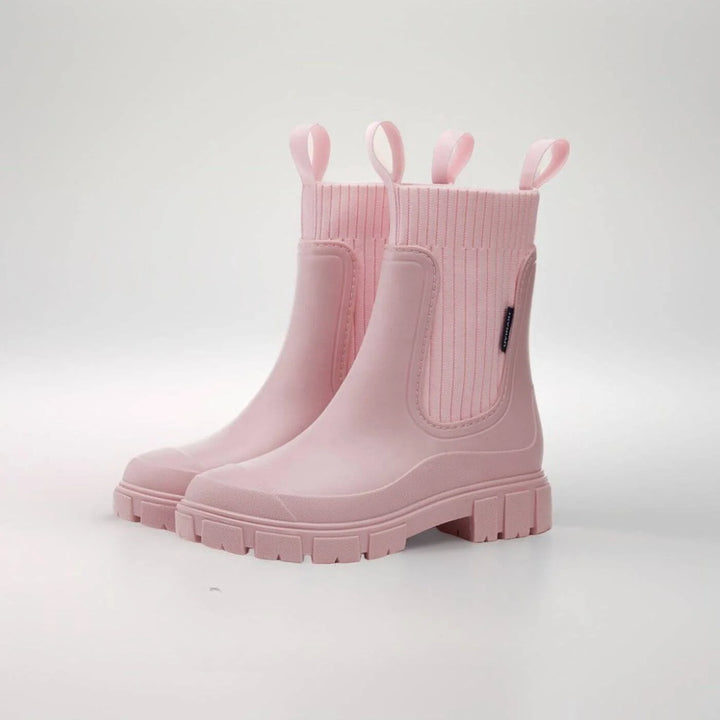 Overhead view of women's Chelsea boots highlighting pull-on access and ribbed elastic panels