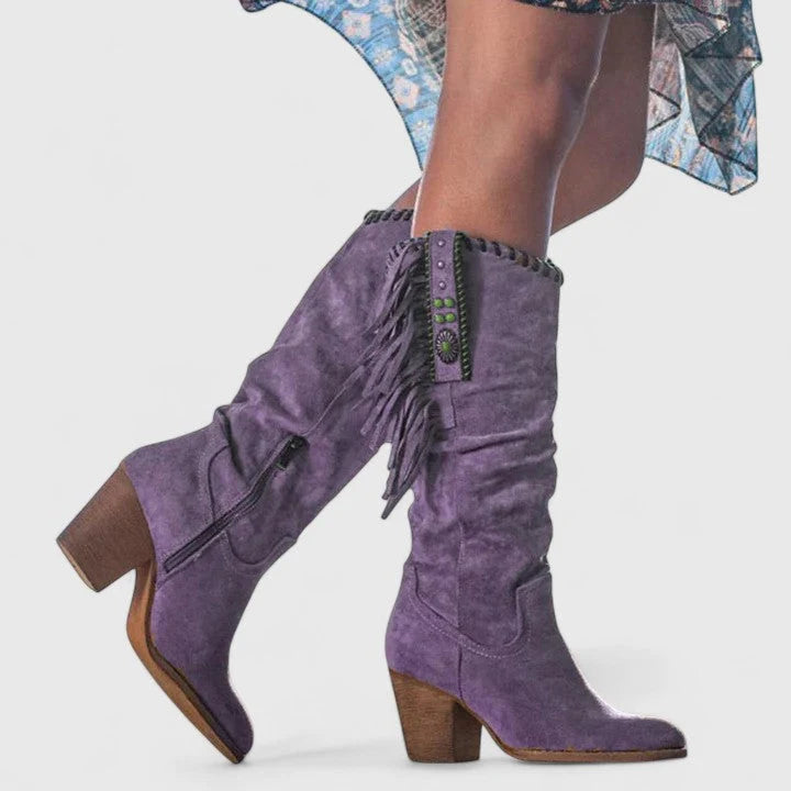 Rear view of fringe cowboy boots displaying block heel and slouched shaft construction