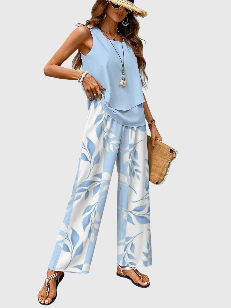 Wiosenny zestaw z warstwową bluzką i szerokimi spodniami w jasnym odcieniu niebieskiego