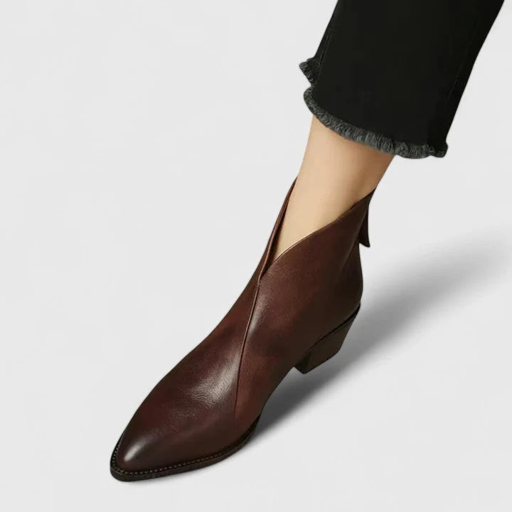Pair of black ankle boots with pointed toe and low heel for everyday wear