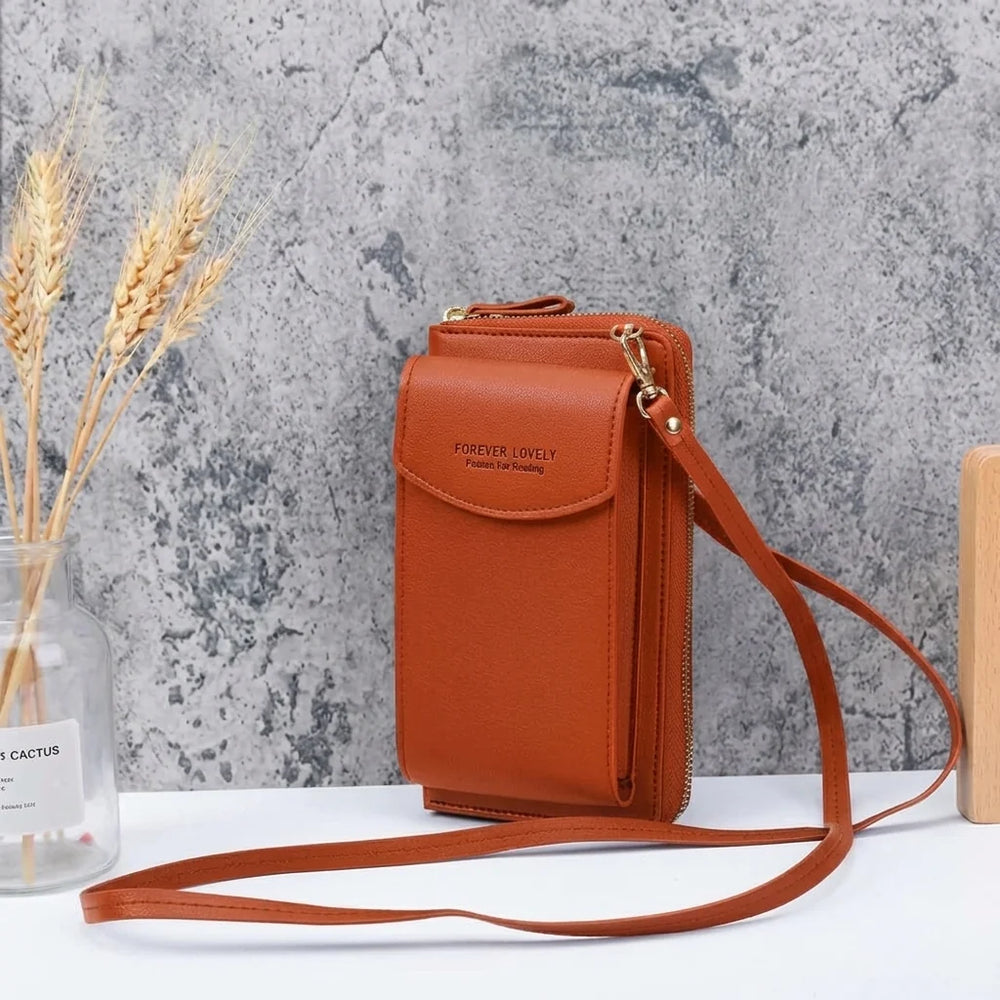 Kompaktowa torebka crossbody z miękkiej skóry ekologicznej z przednimi kieszeniami i suwakiem głównej komory