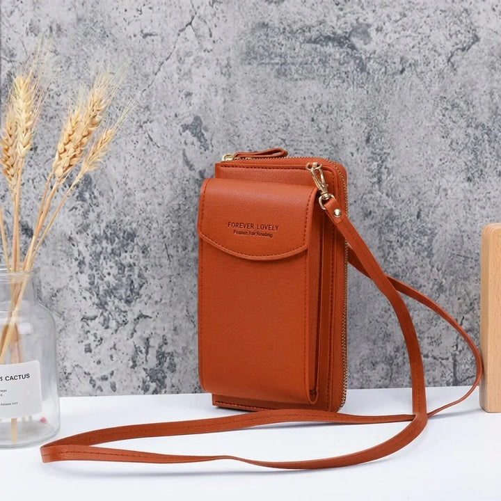 Kompaktowa torebka crossbody z miękkiej skóry ekologicznej z przednimi kieszeniami i suwakiem głównej komory