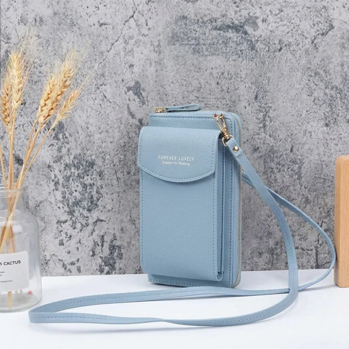 Skórzana torebka crossbody z przednimi kieszeniami organizującymi telefon i karty, zbliżenie na detale