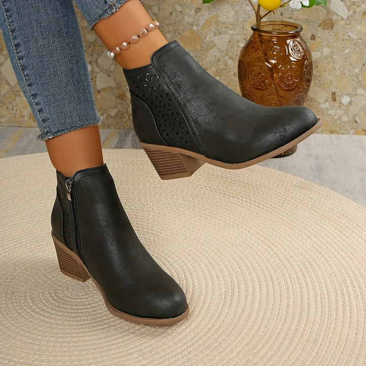 Side view of women's ankle boots with stacked block heel and smooth finish