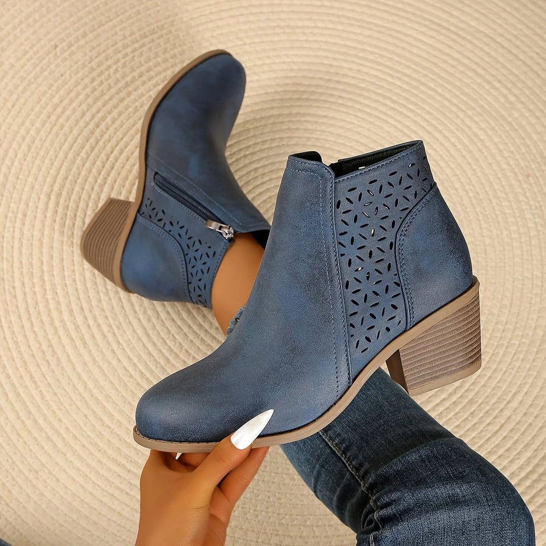 Women's ankle boots in brown tone featuring block heel and decorative laser-cut design