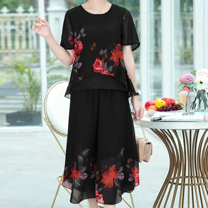 Sukienka midi z okrągłym dekoltem, w kwiaty, warstwowa z czarnej szyfonowej tkaniny z czerwonymi kwiatami i rozkloszowaną spódnicą