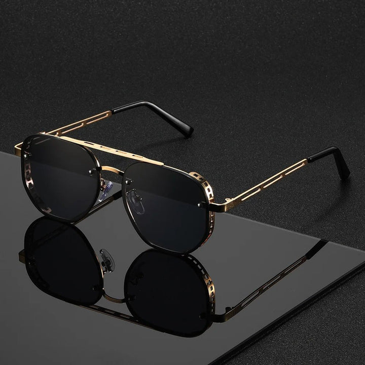 Okulary przeciwsłoneczne damskie aviator z geometryczną oprawą złotą i czarnymi soczewkami gradient leżące na ciemnym tle