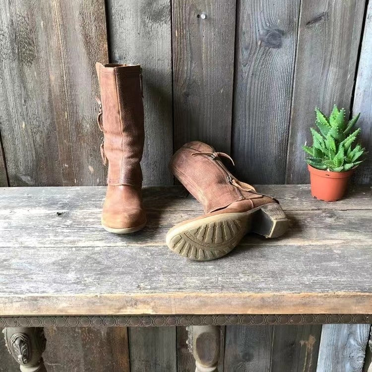 Women's mid-calf boots in brown displaying rounded toe shape and structured finish